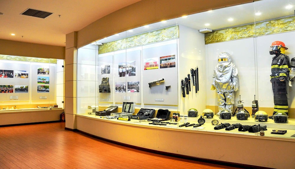 The exhibition room showcases various firearms used by police officers throughout different historical periods